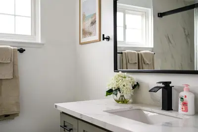 a bathroom with a sink and a mirror at Cozy Full Suites Bright & Private Great Value in Norwalk