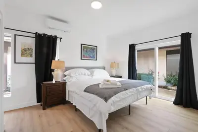 a bedroom with a large bed and a window at New Family House Fanstic View Azusa in Azusa