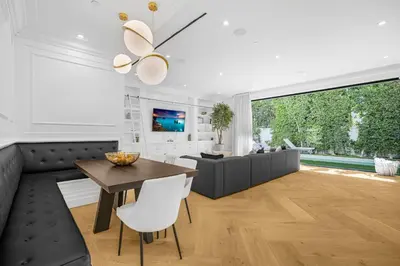 a living room with a table and a couch at Spaulding Ave Farmhouse in Los Angeles