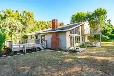 a house with a large yard in front of it at Spacious Retreat with Scenic Mountain Views in Santa Ana