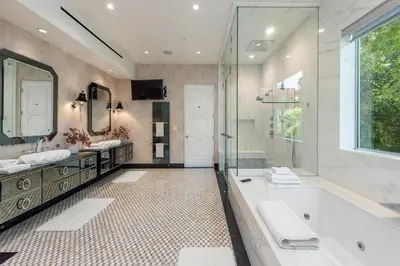 a bathroom with two sinks and a tub and a shower at Alta Royale in Los Angeles
