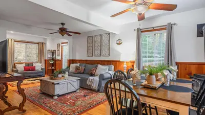 a living room with a couch and a table at Minutes to Lake Arrowhead Village Cozy Secluded Cedar Cove by AvantStay in Lake Arrowhead