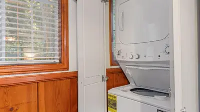 a washer and dryer in a kitchen with a window at Minutes to Lake Arrowhead Village Cozy Secluded Cedar Cove by AvantStay in Lake Arrowhead