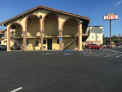 an empty parking lot in front of a building at Sierra Inn in South El Monte