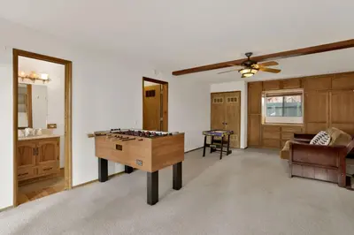 a living room with a ping pong table in it at Vivienda De Osos Walk to the Lake Spacious Fawnskin Retreat Chalet in Fawnskin