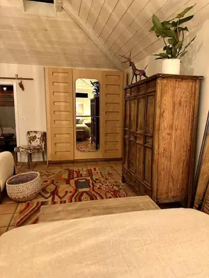 a bedroom with a bed and a large mirror at Ojai Serenity Retreat in Ojai