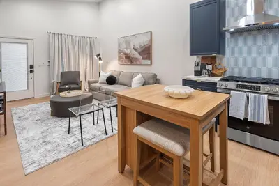a kitchen and living room with a table and a couch at New 1 BR, King Bed, Laundry In-Unit, Parking in Los Angeles