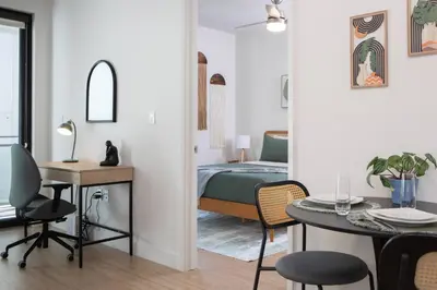 a bedroom with a bed and a table and chairs at * Soho Vibes In The Heart Of Santa Monica * in Los Angeles
