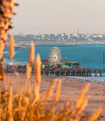 a beach with a ferris wheel and a pier at Laugh in the Lap of Luxury In SM * FREE Parking * in Los Angeles