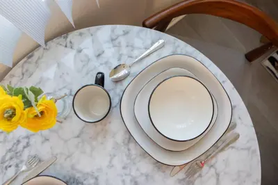 a table with a plate and a cup on a table at * Prime Location Studio Near Santa Monica Pier * in Los Angeles