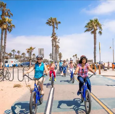 a group of people riding bikes on the beach at * Prime Location Studio Near Santa Monica Pier * in Los Angeles