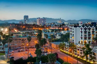 a city skyline at night with buildings and street lights at Luxurious &Spacious 1Bed 1Bath Apt In Santa Monica in Los Angeles