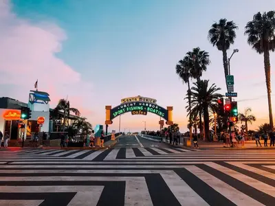 a city street with a crosswalk and a sign for a theatre at Beachside Beauty Steps To The Beach & Restaurants in Los Angeles