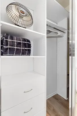 a white closet with white drawers and a fan at Ocean Lover's Dream Studio In Santa Monica in Los Angeles
