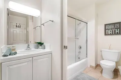 a white bathroom with a sink and a toilet at Ocean Lover's Dream Studio In Santa Monica in Los Angeles