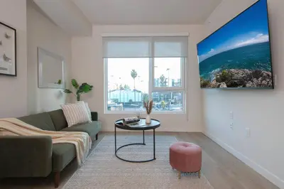 a living room with a couch and a table at 5-Star West Hollywood Living | Modern & Central in Los Angeles
