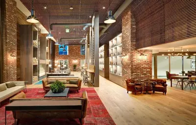 a living room with a couch and chairs and a table at West Hollywood Luxe | 2BR/2BA Resort Style in Los Angeles