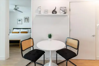 a room with a table and two chairs and a bed at Santa Monica 1BR apt with Parking in Los Angeles