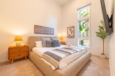a bedroom with a bed and a window at The Village Collection with Gym Pool and Spa in Montclair