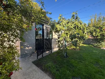 a house with a garden with a tree in the yard at Burbank - Starlight Hills Private Luxury Guest House in Burbank