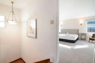 a white room with a bed and a bedroom at Spacious 4BR Spanish Villa In Hancock Park in Los Angeles