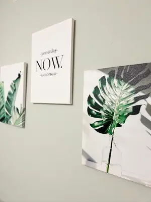 a picture of a plant on a wall next to two pictures at Pasadena Charming Vacation Home with Hot Jacuzzi in Pasadena