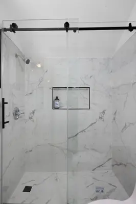 a shower with a glass door in a bathroom at Pasadena Charming Vacation Home with Hot Jacuzzi in Pasadena
