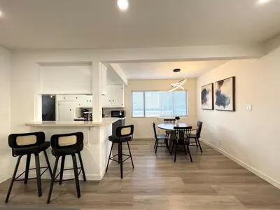 a kitchen and dining room with a table and chairs at Private Flat 15 min to Pasadena, DTLA, JPL in Alhambra