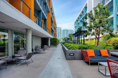 an outdoor patio with chairs and tables in a building at Marina del Rey 2BR w Pool Gym nr beach LAX-636 in Los Angeles