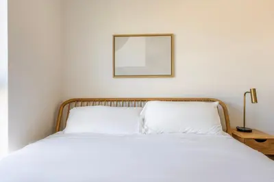 a bedroom with two beds and a picture on the wall at Blueground East Hollywood balcony nr Echo Park LAX-1336 in Los Angeles