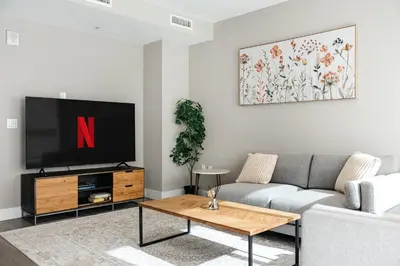 a living room with a tv and a couch at Excellent Town Home 2BR in WEHO Parking,Gym,Pool in Los Angeles