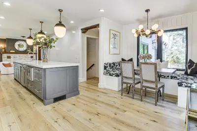 a kitchen and dining room with a table and chairs at Walk to Lake Arrowhead Village! Home with Lake Views in Lake Arrowhead