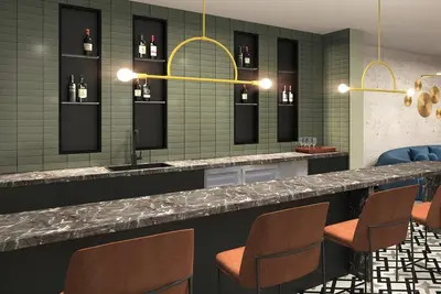 a bar with chairs and a counter with wine bottles at Penthouse Corner 3 Bedroom Condo with Large Private Balcony and Parking in Los Angeles