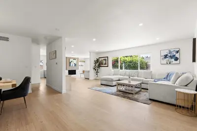 a living room with a couch and a table at NEW Remodeled Northridge 5 Bedroom Near CSUN & Sherwood Forest in Northridge