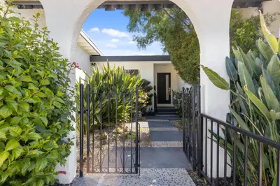 an entrance to a house with an arched gate at NEW Remodeled Northridge 5 Bedroom Near CSUN & Sherwood Forest in Northridge