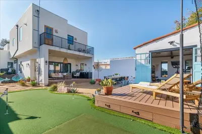 a backyard with a wooden deck and a house at Bohemian Dream Studio Close to LA Stadium SOFI Kia Forum Intuit Dome LA Coliseum in Los Angeles
