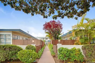 a house with a fence and a sidewalk at Bright and Comfortable 2 Bedrooms with Views in Santa Monica in Los Angeles