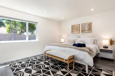 a bedroom with a large bed and a window at Cozy & Bright Santa Clarita Retreat in Santa Clarita