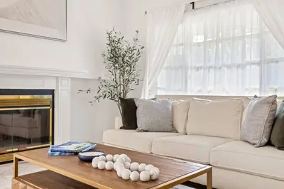 a living room with a couch and a coffee table at GOODE.HOMES | Luxury Home w/ Beautiful Garden in Santa Clarita