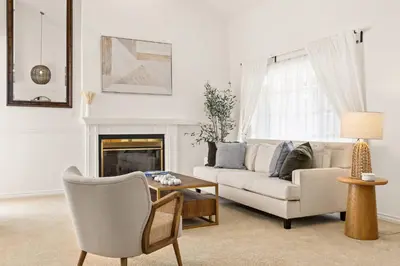 a living room with a couch and a table at GOODE.HOMES | Luxury Home w/ Beautiful Garden in Santa Clarita