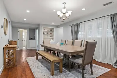 a dining room with a table and chairs at Luxury home w/ yard + parking in Newhall