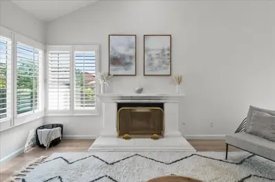 a living room with a fireplace and a couch at Goode.Homes Hilltop Home w. private pool/spa in Newhall