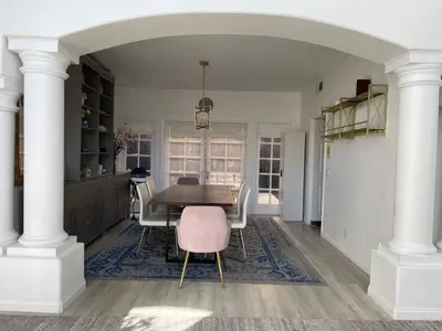 a dining room with a table and chairs at Large 6-bedroom house w/jacuzzi in Monterey Park