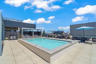 a swimming pool on the roof of a building at Stylish City Escape Walk to Shops Dine & Explore in Long Beach