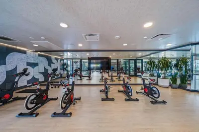 a gym with a bunch of exercise bikes in a building at Stylish City Escape Walk to Shops Dine & Explore in Long Beach