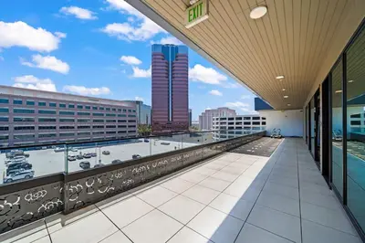 a balcony with a view of a city skyline at Chic Downtown Stay Walk to Beach in Long Beach
