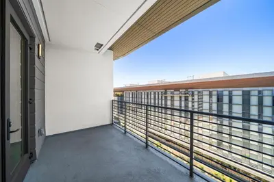 an empty balcony with a view of a building at Top-Floor Gem & Heated Pool Walk to Attractions in Long Beach