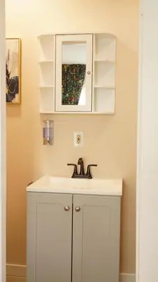 a bathroom with a white sink and a mirror at Entire house with 3 rooms in Alhambra
