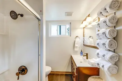 a bathroom with a toilet and a sink and a shower at 2 Mi to Lake Arrowhead! Mtn-View Hideaway with Deck in Cedar Glen