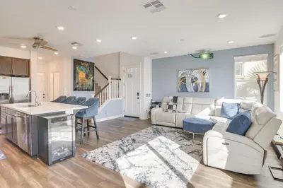 a living room with a couch and a table at Home Theater System and Gazebo Los Angeles Getaway! in San Fernando